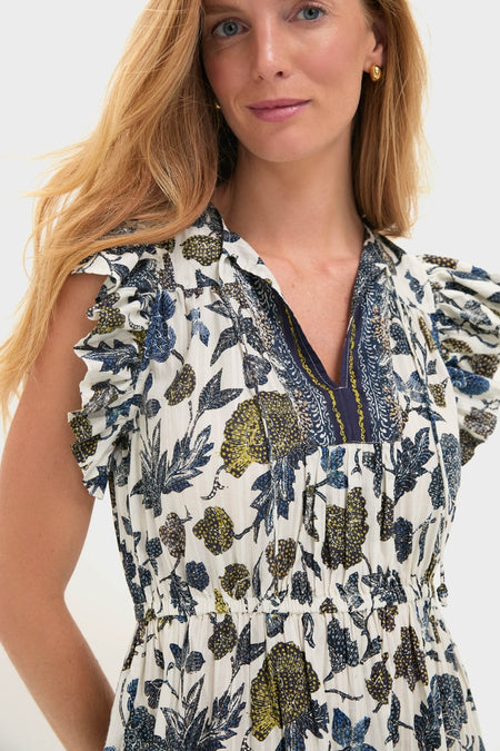 Porcelain Kairi Dress: A classic, high-end sleeveless dress with a gathered waist, effortless botanical prints, and fun ruffled cap sleeves, embodying Tuckernuck's cool, confident style.