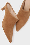 Camel Suede Whipstitch Kathryn Mules, classic and effortless, feature a pointed toe, block heel, and decorative whip-stitch trim, embodying Tuckernuck’s fun and high-end style.