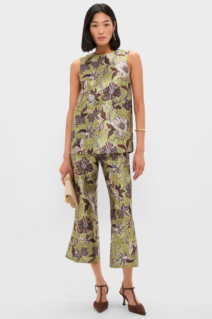 Woman wearing classic Chocolate Suede Margot Heels, showcasing effortless style with T-strap design, pointed toe, and comfortable stiletto kitten heel, embodying fun, high-end fashion.