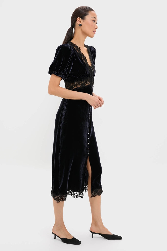 Classic and effortless, the Navy Clarice Velvet Puff Sleeve Midi Dress features a deep V-neck, lace accents, and a buttoned front, exuding a high-end, fun style.