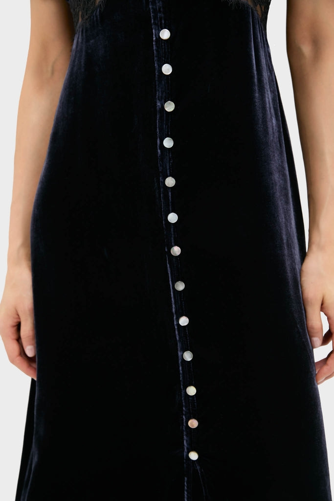 Navy Clarice Velvet Puff Sleeve Midi Dress featuring classic pearly buttons, offering an effortless, high-end style that's both fun and sophisticated, perfect for any occasion.