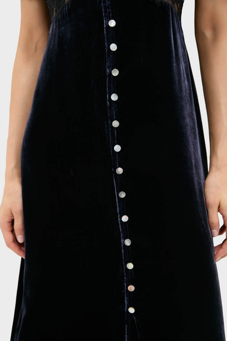Navy Clarice Velvet Puff Sleeve Midi Dress featuring classic pearly buttons, offering an effortless, high-end style that's both fun and sophisticated, perfect for any occasion.