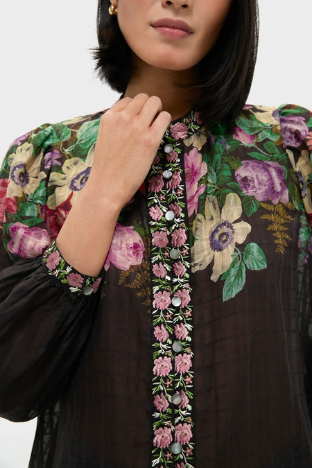 Woman in a classic, effortless Multi Viktoria Print Long Sleeve Blouse with floral embroidery and sheer fabric, exuding high-end, fun style from Tuckernuck.