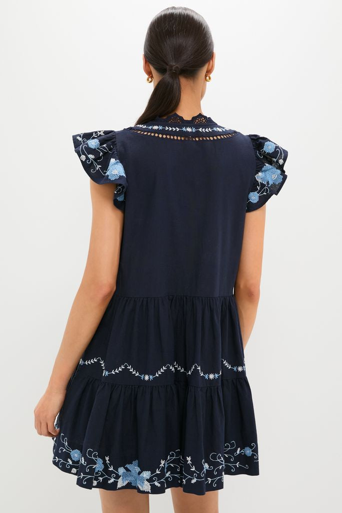 Exclusive Navy Edwina Embroidery Tunic Dress: Classic and effortless, featuring intricate floral embroidery, flutter sleeves, and a tiered design for a fun, high-end look.
