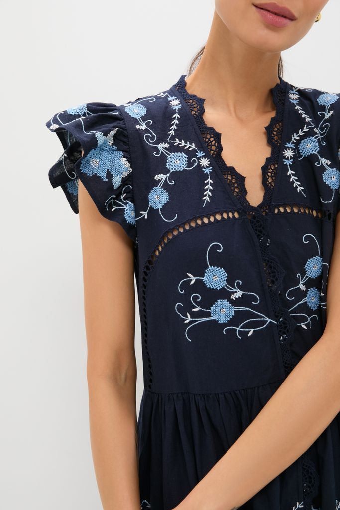 Exclusive Navy Edwina Embroidery Tunic Dress with intricate floral embroidery, lace trim, and ruffled sleeves, exudes a classic, effortless, high-end, and fun bohemian style.