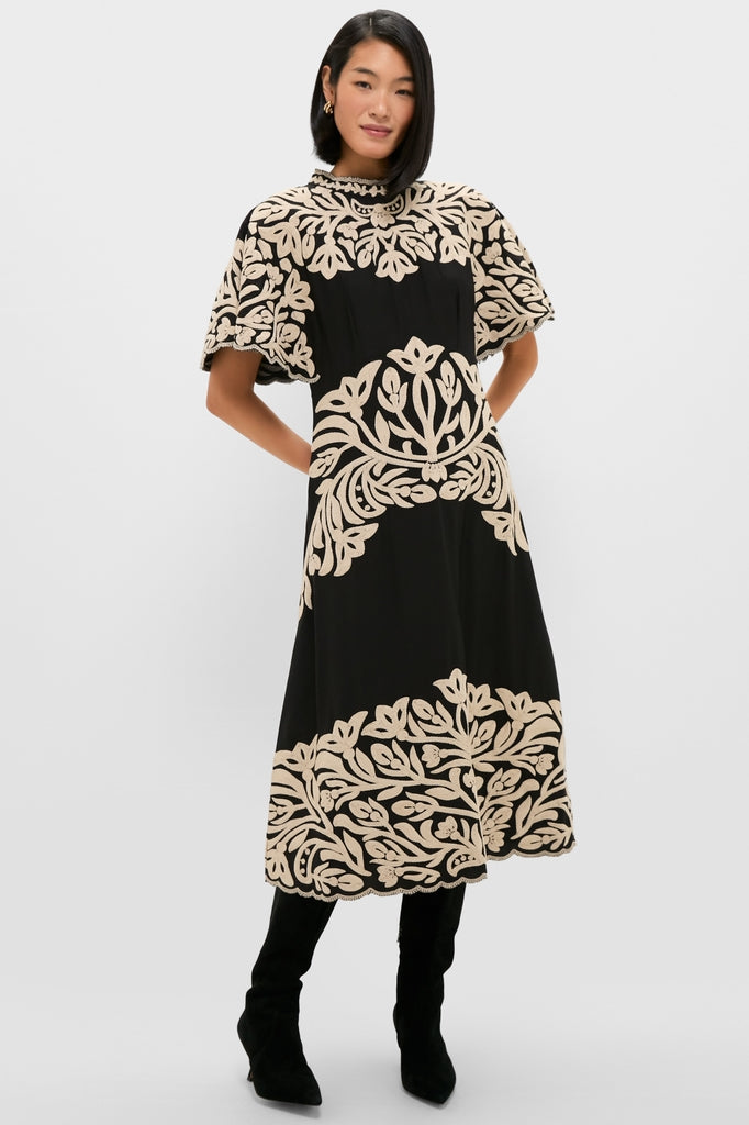 Model wearing Black Alexandra Embroidery Short Sleeve Midi Dress: a classic, high-end piece featuring bold floral embroidery, high neckline, flutter sleeves, and an effortless A-line silhouette.