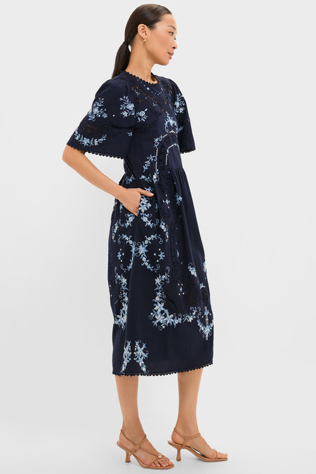 Exclusive Navy Edwina Embroidery Midi Dress with intricate floral embroidery, lace detailing, and pockets, exuding a classic, effortless, and fun high-end appeal.