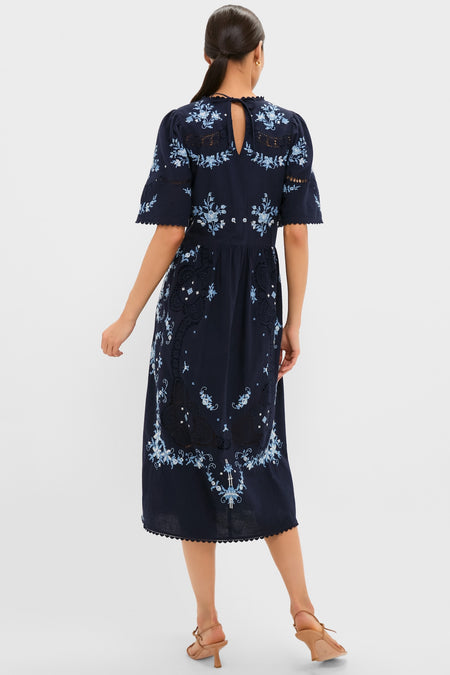 Exclusive Navy Edwina Embroidery Midi Dress with intricate floral embroidery and scalloped sleeves, exudes a classic, effortless elegance, perfect for a fun, high-end style.