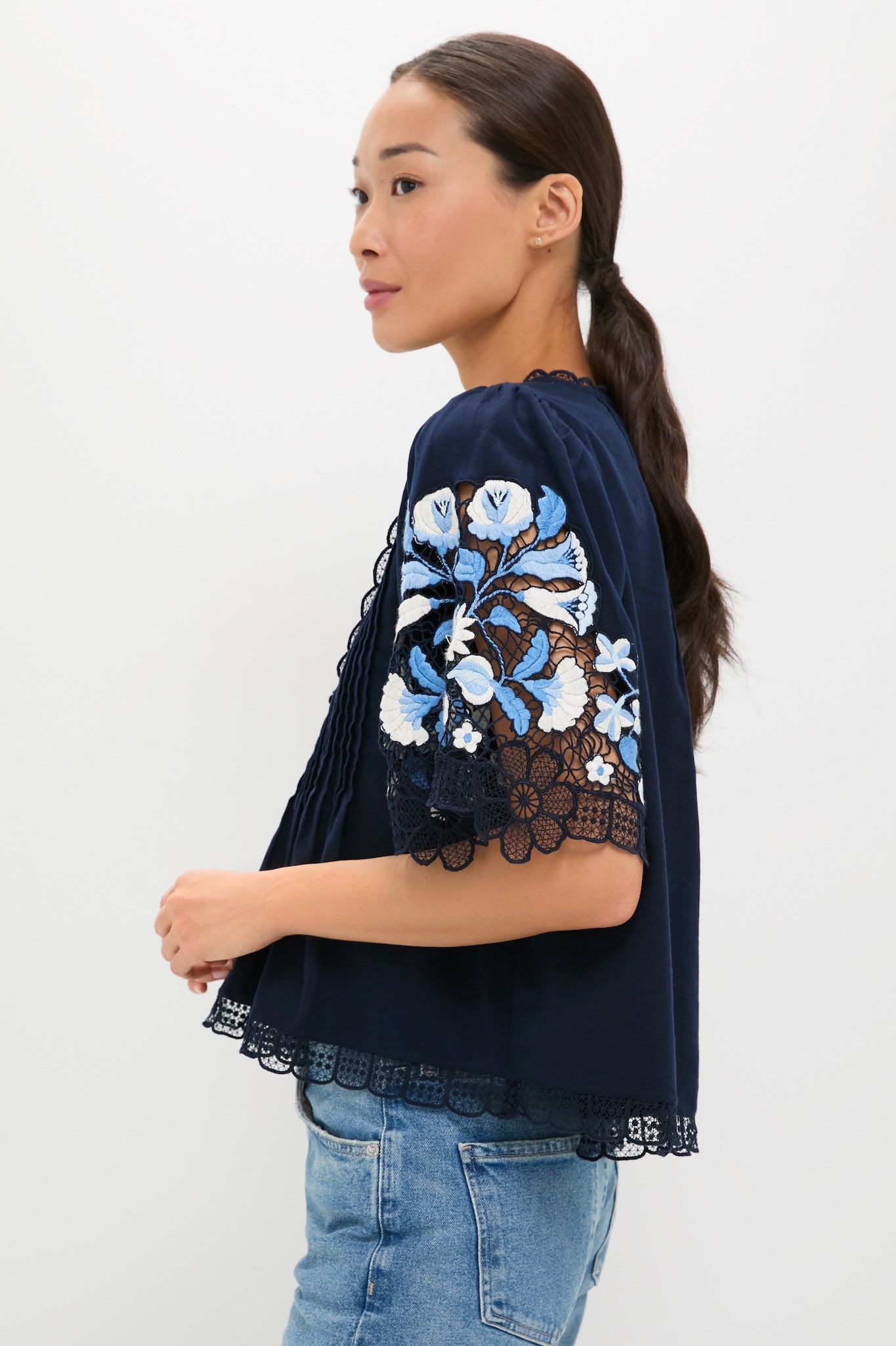 Classic and effortless, the Exclusive Navy Edwina Embroidery Short Sleeve Top features intricate floral embroidery and scalloped lace, pairing high-end design with fun, casual denim.
