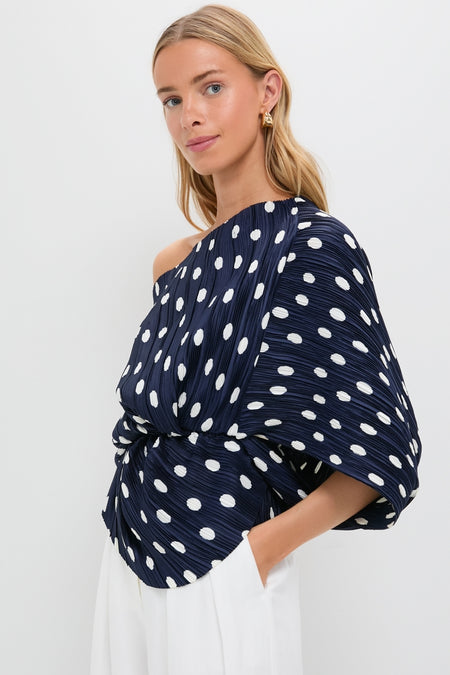 Young woman models the Small Dot Deep Lake Cami Top, a classic, high-end, off-shoulder navy blouse with polka dots and kimono sleeves, exuding effortless, fun style.