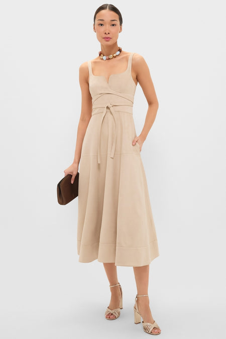Model wearing a classic, sand-beige midi dress with a square neckline, featuring the Saddle Bauble Multi Mercier Choker for an effortless, high-end, and fun look.