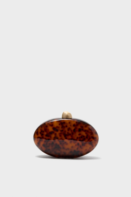 Caramel Tortoise Eviana Clutch: An effortlessly classic, high-end acrylic evening bag with a fun tortoiseshell pattern, featuring a gold clasp and removable chain strap.