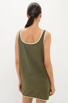 Woman in an olive green Fern Embroidered Mini Terrycloth Dress Coverup, back view, exuding effortless, high-end style with classic off-white trim for a fun, confident look.