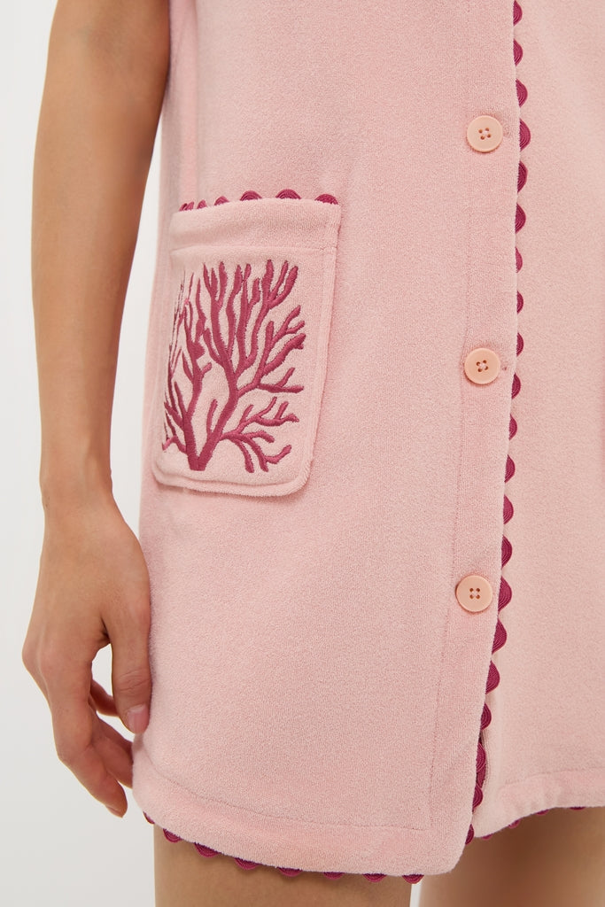 Coral Embroidered Mini Bermuda Terrycloth Coverup features a classic, effortless design with a front button placket, scalloped trim, and embroidered patch pocket for a fun, high-end look.