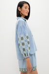Young woman models the classic, effortless Sky Geometric Embroidered Paget Top, showcasing fun geometric embroidery and blouson sleeves, embodying Tuckernuck's high-end, relaxed summer style.