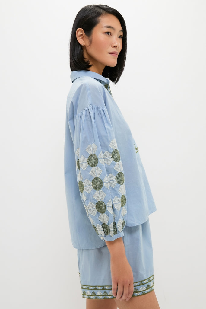 Young woman models the classic, effortless Sky Geometric Embroidered Paget Top, showcasing fun geometric embroidery and blouson sleeves, embodying Tuckernuck's high-end, relaxed summer style.