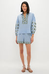 Sky Geometric Embroidered Paget Top with blouson sleeves and olive geometric embroidery, paired with matching shorts for an effortless, high-end, and fun summer look.
