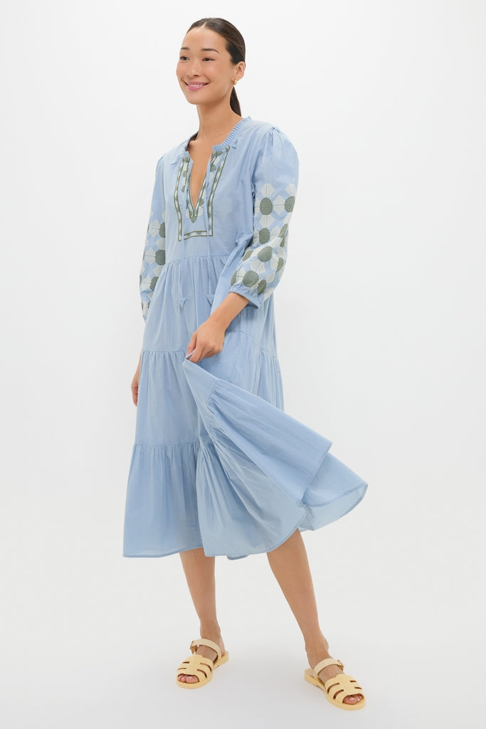 Person wearing the Sky Geometric Embroidered Long Sleeve Salty Paloma Caftan, showcasing its classic, effortless design with fun embroidery, perfect for a high-end, summery look.