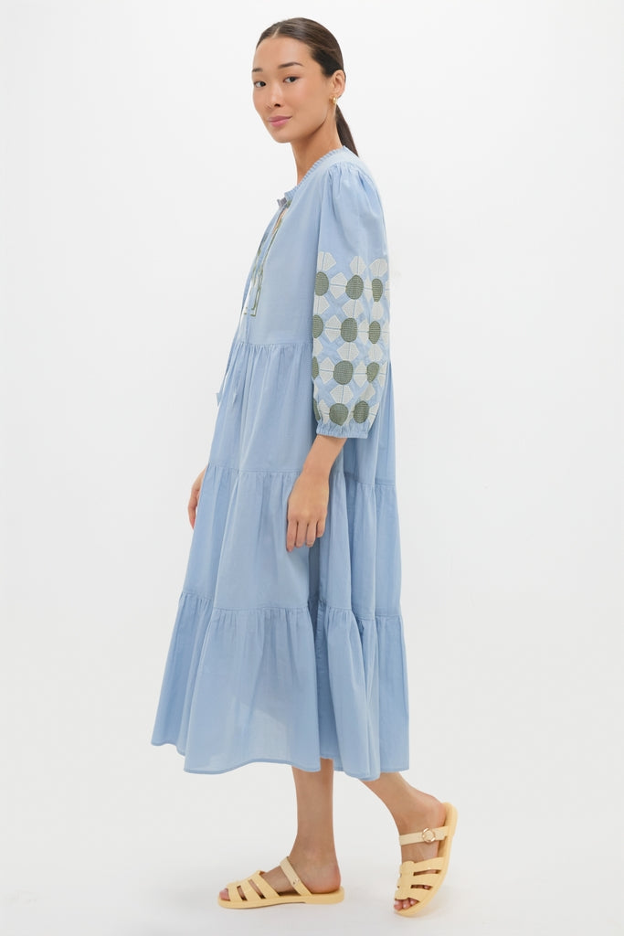 Model wearing the classic Sky Geometric Embroidered Long Sleeve Salty Paloma Caftan, showcasing effortless style with its fun geometric pattern and high-end design.