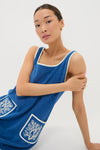 Cobalt Embroidered Terrycloth Dress Coverup: A classic, effortless knee-length royal-blue dress featuring off-white trim, fun front pockets with high-end embroidery, perfect for a cool, confident look.