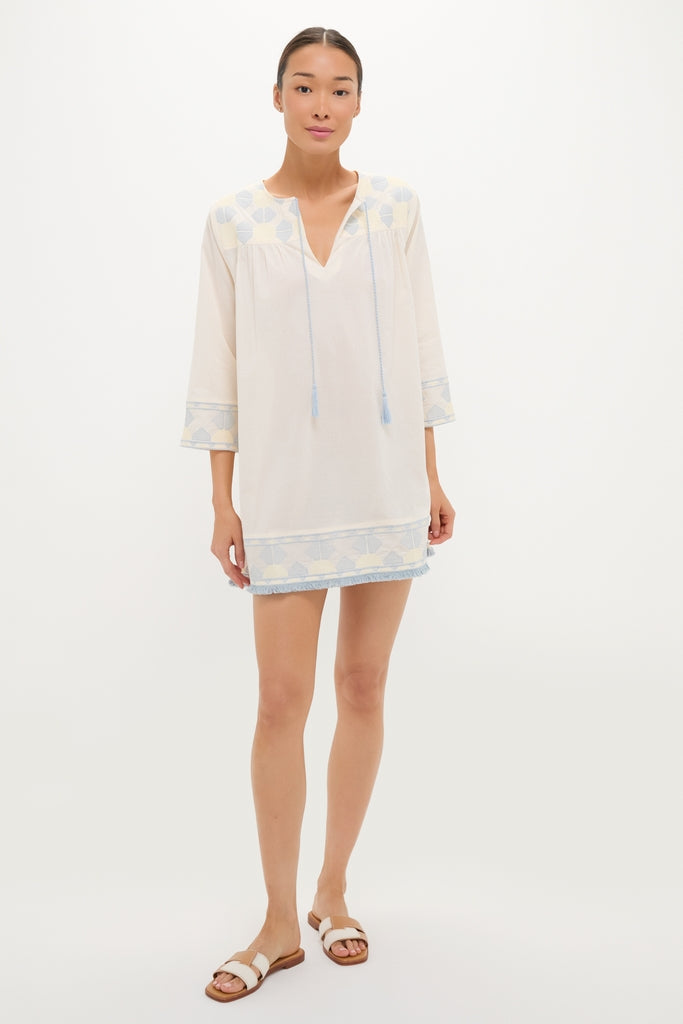 Neblina Geometric Embroidered Bondi Coverup: A classic, effortless tunic-style mini dress with three-quarter sleeves, featuring fun, high-end geometric embroidery and tassel ties.