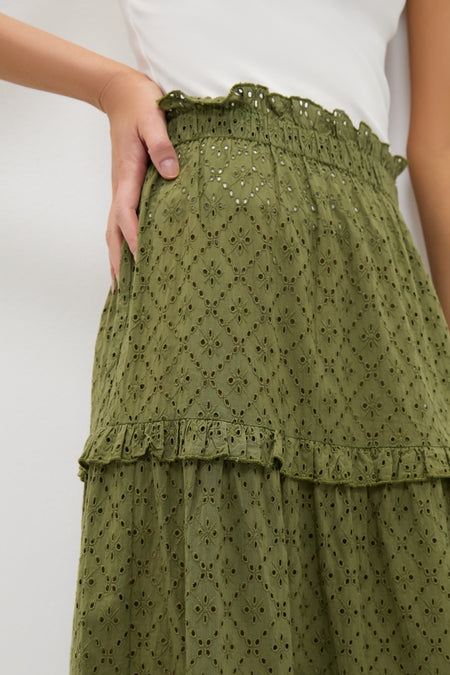 Close-up of the Fern Eyelet Prado Skirt, showcasing its effortless, high-end style with classic tiered layers and a fun ruffled waistband.