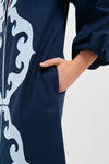Navy & Baby Blue Embroidered Teresa Caftan featuring classic scroll-style embroidery, long sleeves with gathered cuffs, and side-seam pocket for an effortless, high-end look.