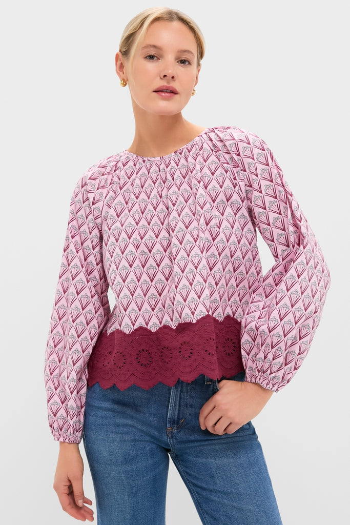 Blush Trellis Floral Marika Blouse with classic puff sleeves and scalloped hem, paired effortlessly with mid-wash jeans for a fun, high-end, everyday look.