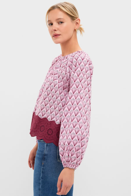 Blush Trellis Floral Marika Blouse with classic crew neckline and puff sleeves, styled with denim for an effortless, fun, and high-end everyday look.