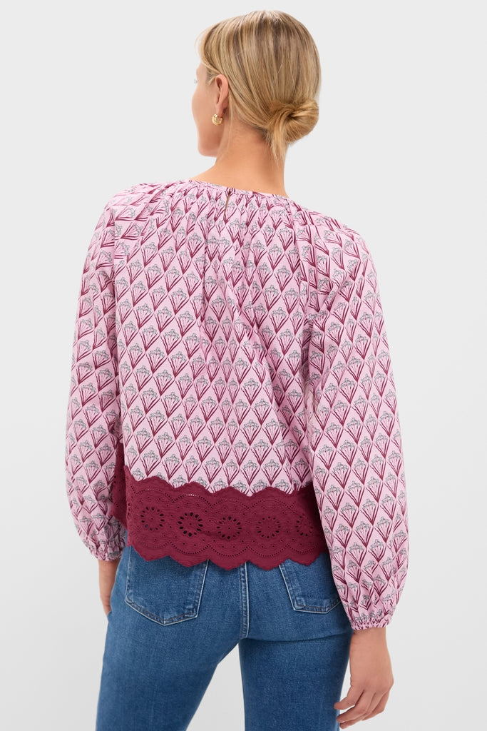 Blush Trellis Floral Marika Blouse: A classic, effortless top featuring puff sleeves and a scalloped hem, perfect for pairing with jeans for a fun, high-end look.