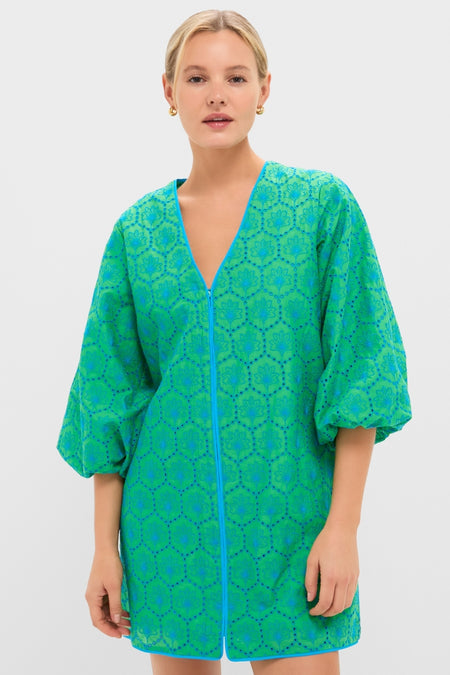 Model wearing the Seafoam Palm Eyelet Mini Arem Caftan, a classic, high-end tunic with a fun, effortless floral-medallion pattern, front zipper, and puffed sleeves.