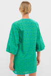 Person wearing a classic, high-end Seafoam Palm Eyelet Mini Arem Caftan with effortless puffed sleeves and a fun eyelet pattern, embodying Tuckernuck's cool style.