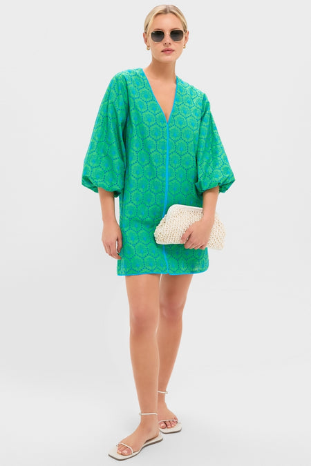 Model in Seafoam Palm Eyelet Mini Arem Caftan, featuring a geometric pattern and balloon sleeves, paired with chic accessories for a classic, effortless, and fun high-end look.