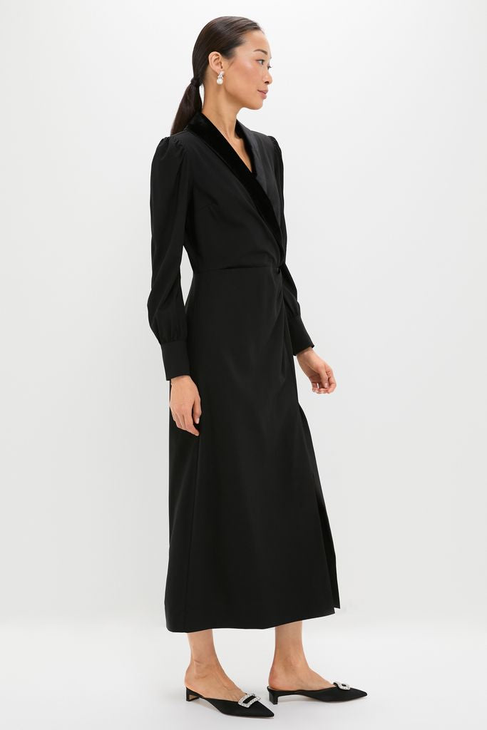 Model in a classic, high-end Black Long Sleeve Mariella Midi Dress with velvet trim and puffed shoulders, styled effortlessly with pointed-toe mules.