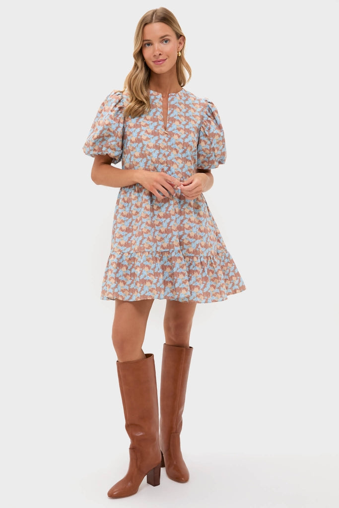 Model in a classic Brown & Powder Blue Floral Zip Front Ellie Mini Dress with puff sleeves, knee-high brown boots, and gold hoop earrings for an effortless, high-end look.