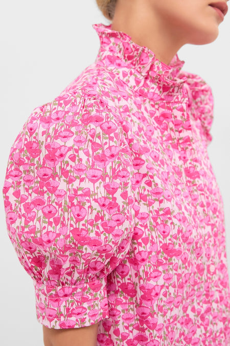 Classic and effortless, the Pink Poppies Floral Louisa Maxi Dress features a high-neck, puff-sleeve design with bright floral patterns, epitomizing fun, high-end style.