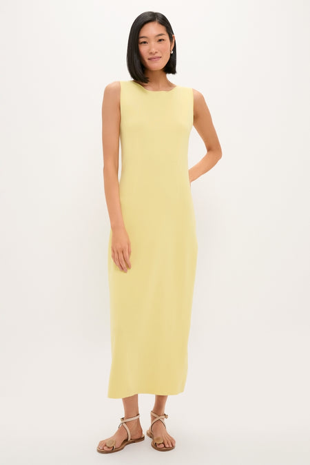 Young woman in Lemongrass Kingston Knit Dress, a classic, effortless sheath maxi, styled with tan sandals for a high-end, fun look.