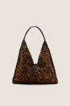 Leopard Medium Origami Shoulder Bag in slouchy leopard print with black leather trim and drawstring closure, embodies classic high-end style for effortless, fun day-to-night versatility.