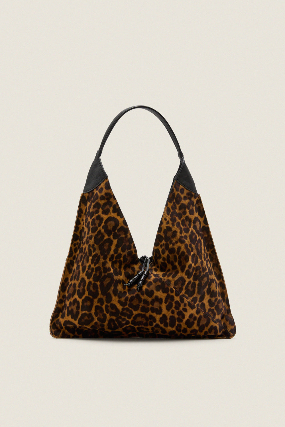 Leopard Medium Origami Shoulder Bag in slouchy leopard print with black leather trim and drawstring closure, embodies classic high-end style for effortless, fun day-to-night versatility.