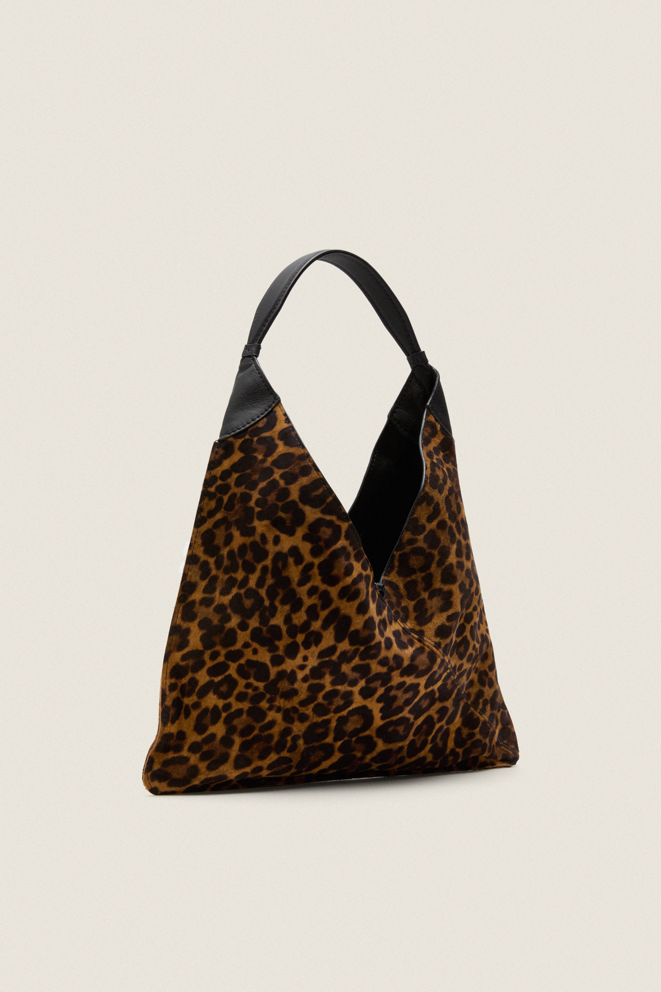 Leopard Medium Origami Shoulder Bag: a classic hobo tote with a bold leopard print and black leather accents; effortlessly transitions from day to night, embodying high-end, fun style.