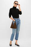 Model showcases the Leopard Medium Origami Shoulder Bag, a classic and effortless high-end accessory with a bold leopard print, perfect for fun, versatile styling.