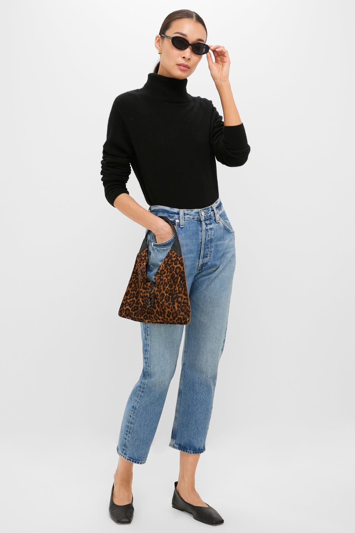 Model showcases the Leopard Medium Origami Shoulder Bag, a classic and effortless high-end accessory with a bold leopard print, perfect for fun, versatile styling.