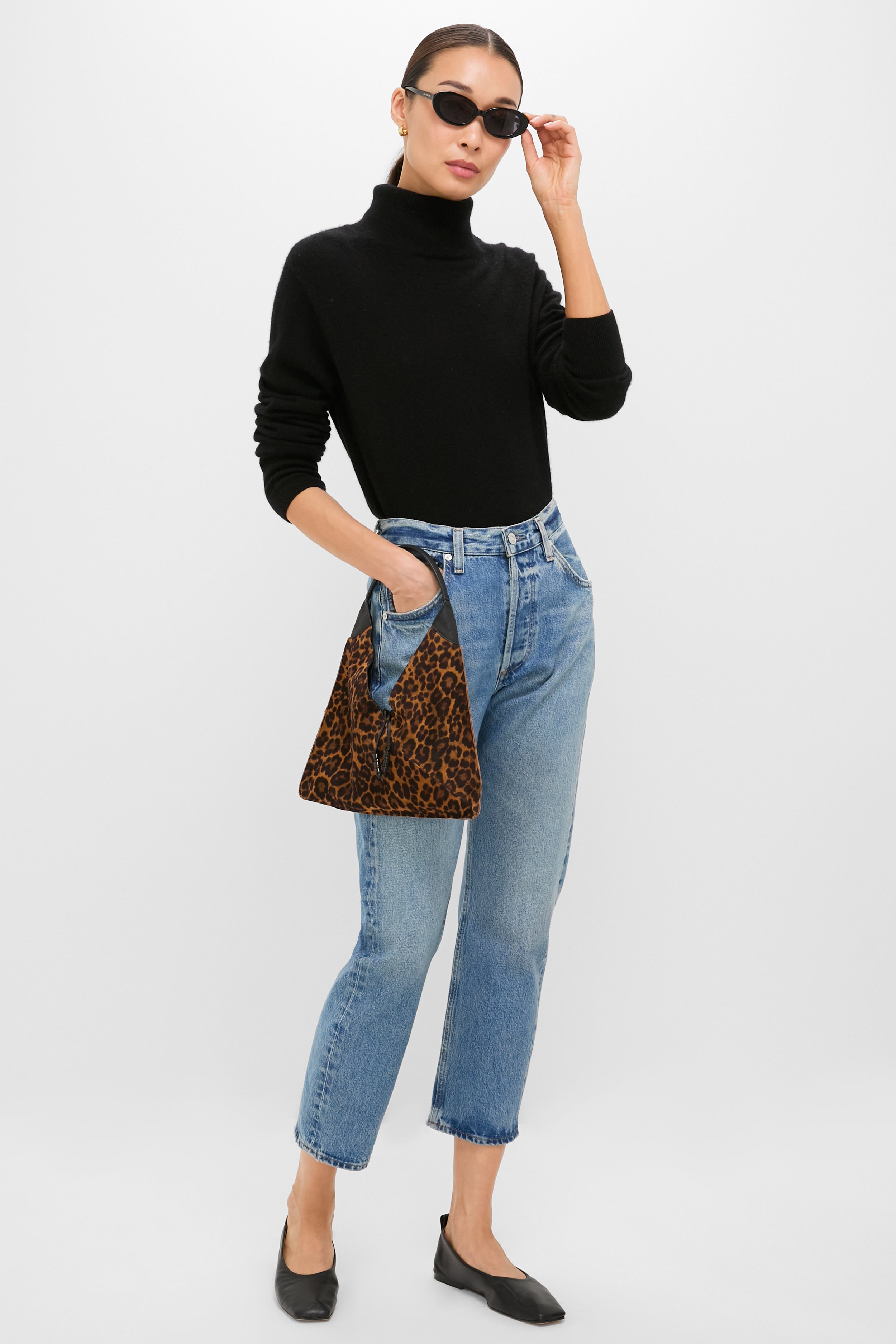 Model showcases the Leopard Medium Origami Shoulder Bag, a classic and effortless high-end accessory with a bold leopard print, perfect for fun, versatile styling.