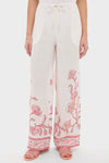 Hibiscus Bloom Pink Florentine Pants showcase a classic, effortless style with a relaxed silhouette, pink floral print, and adjustable drawstring, perfect for a high-end, fun getaway.