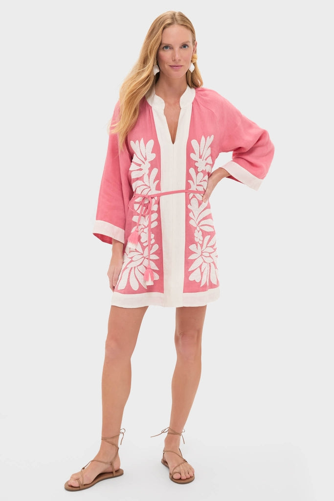 Flora Pink Lumi Mini Dress: A fun, classic tunic-style dress with white embroidery and trims, featuring an effortless belt and wide sleeves. Perfect for a high-end, confident look.