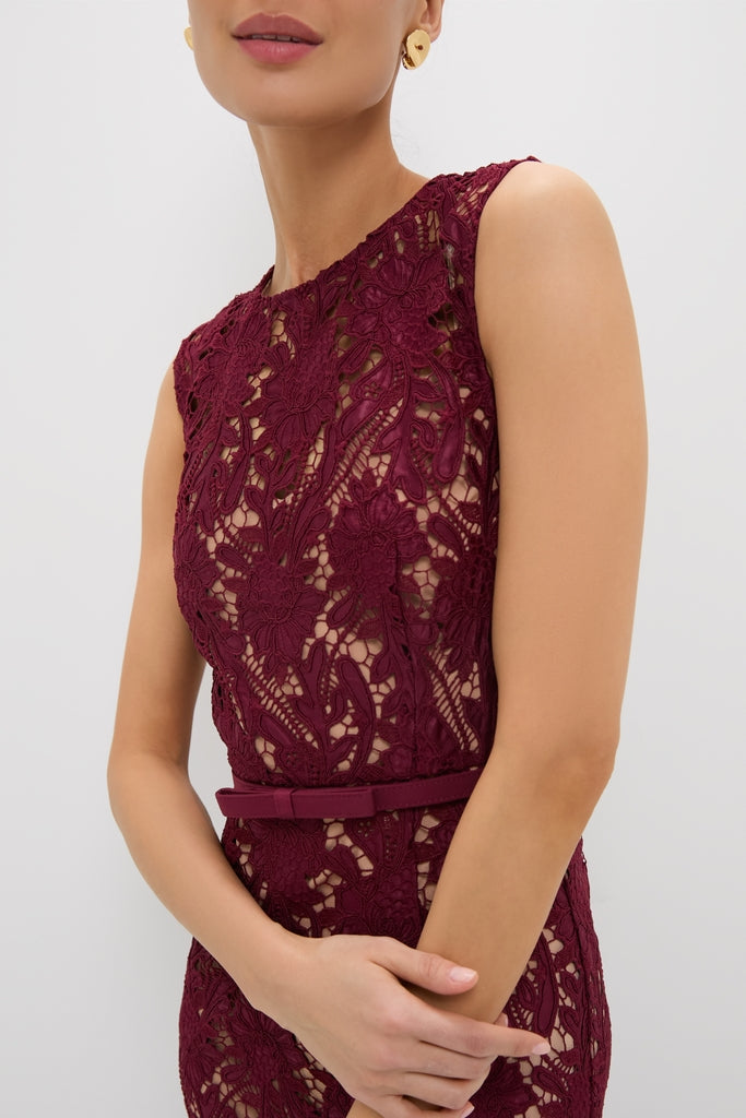 Woman in a classic, high-end Burgundy Guipure Lace Midi Dress with a thin belt, showcasing an effortless and fun style, embodying Tuckernuck's confident aesthetic.