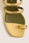 Gold Modia Sandals: Classic flat sandal with metallic gold textured straps, olive-green footbed, and toe-loop. Effortlessly high-end, perfect for fun, polished looks.