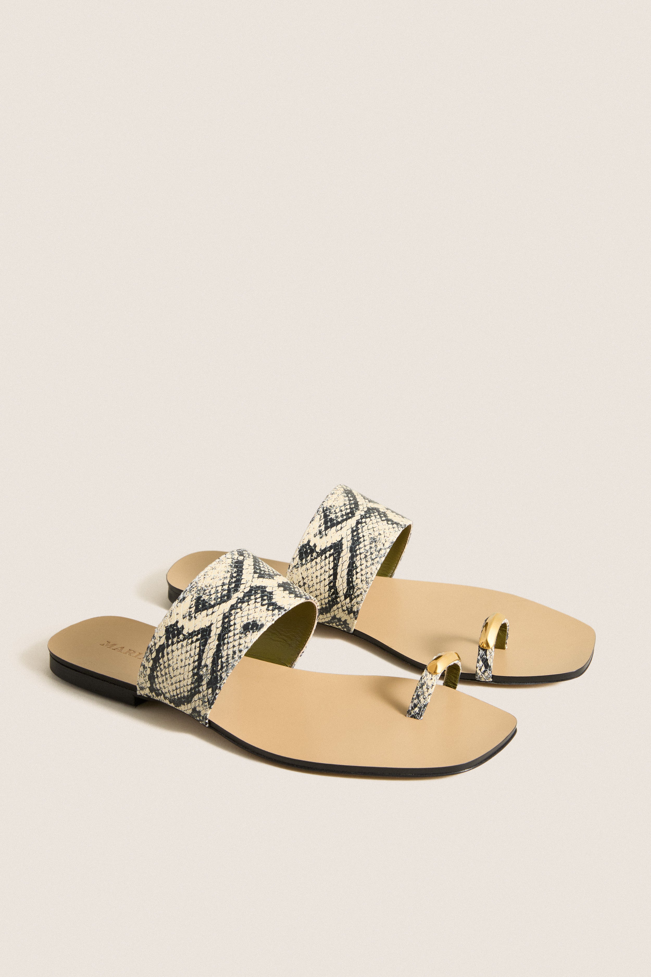 Natural Snake Oleandrea Capri Flat Sandals: Classic, effortless slide-on sandals with a python-print band and chic gold-tone toe loop, perfect for high-end, fun everyday style.