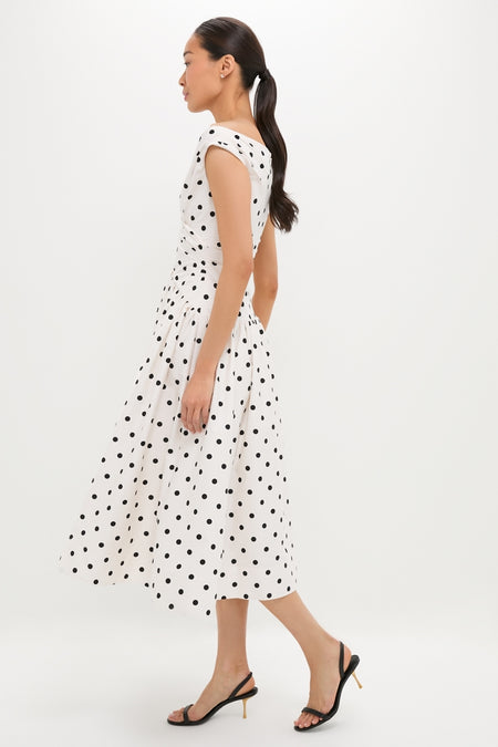 Effortless elegance in the classic Cream Polka Dot Cotton Midi Dress, featuring a playful sweetheart neckline and gathered waist, paired with high-end slingback sandals.