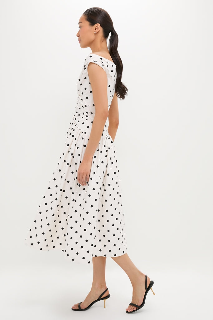 Effortless elegance in the classic Cream Polka Dot Cotton Midi Dress, featuring a playful sweetheart neckline and gathered waist, paired with high-end slingback sandals.